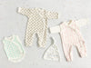 Tiny baby and first size baby clothes