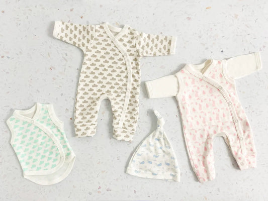 Tiny baby and first size baby clothes