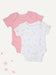 Two short-sleeve baby bodysuits laid flat on a light cream background: one solid light pink and one white with a scattered small pink floral print. No person, animal, or real environment is present.