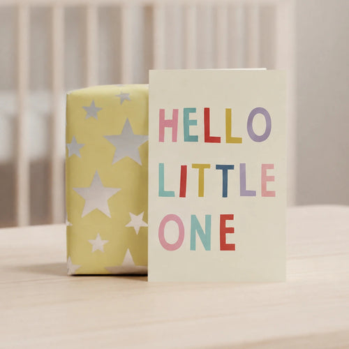 Baby shower card with 'Hello Little One' text and star patterns on a crib background