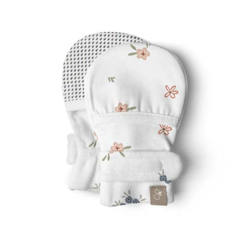 White baby glove with floral pattern on a white background