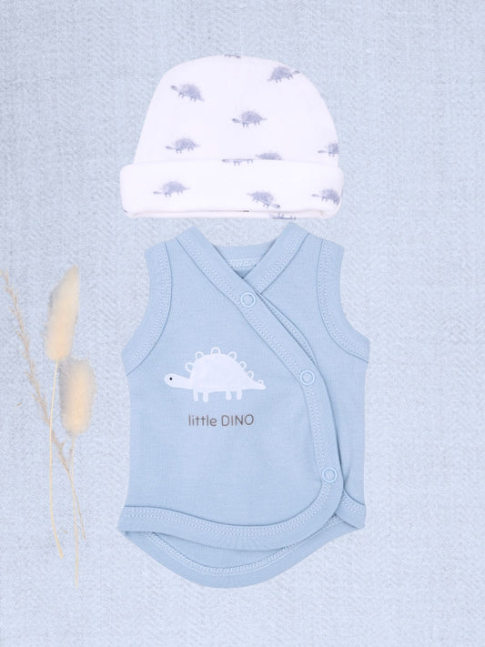 A baby clothing set featuring a light blue wrap bodysuit and a white beanie hat, both decorated with dinosaur motifs. The bodysuit has a white dinosaur graphic and the text 'little DINO' printed on the front.