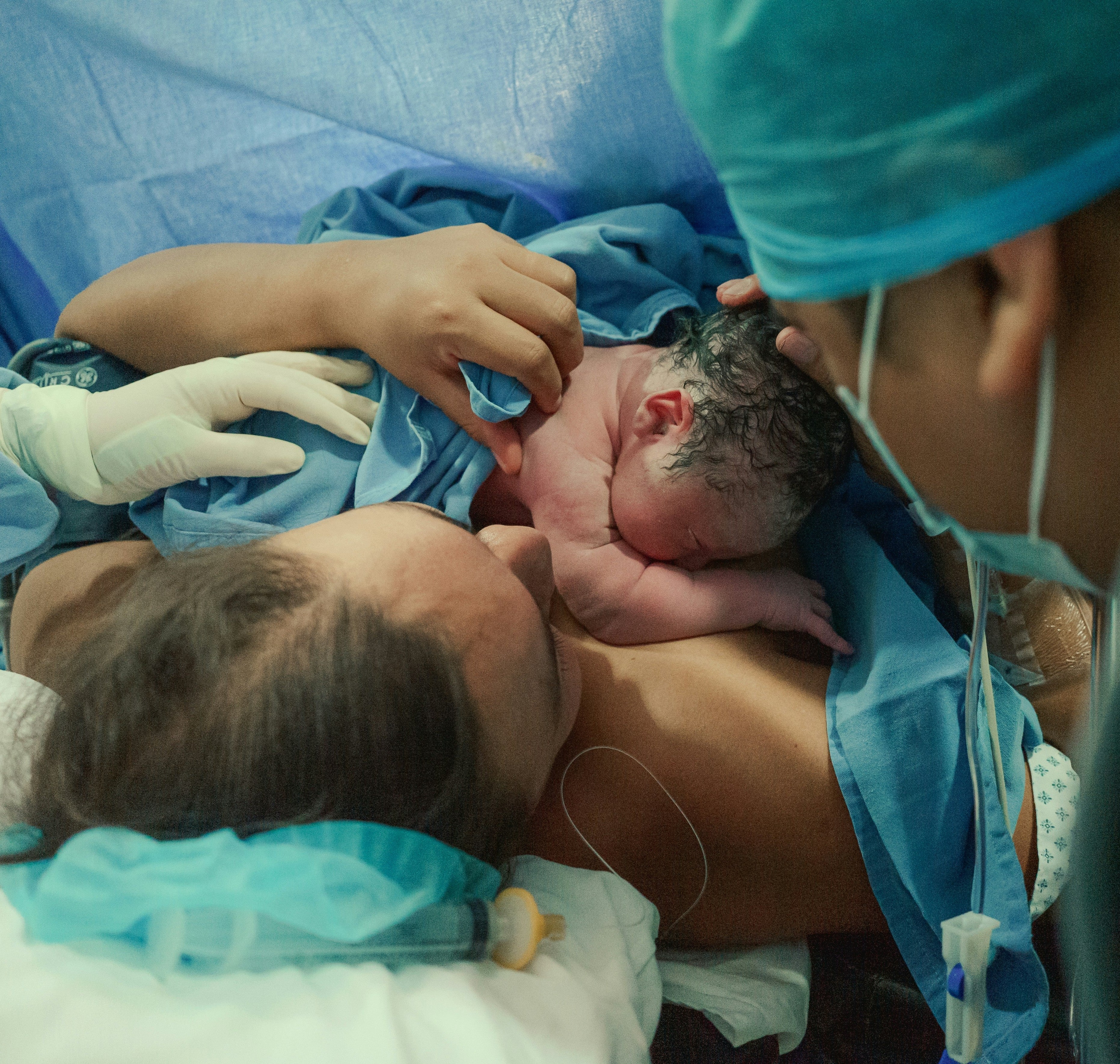 Nurse with new baby and parent
