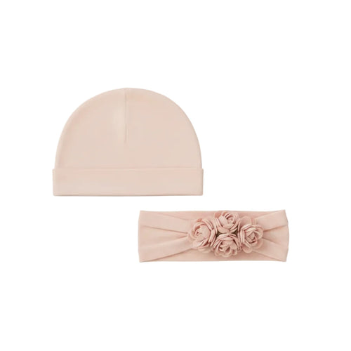 Beige baby hat and headband set on a white background