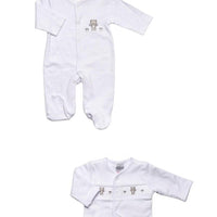 A two-piece baby clothing set on a white background, featuring a white long-sleeve footed sleeper with a small embroidered bear on the chest, and a matching white long-sleeve cardigan with snap buttons and decorative bear embroidery.