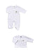 A two-piece baby clothing set on a white background, featuring a white long-sleeve footed sleeper with a small embroidered bear on the chest, and a matching white long-sleeve cardigan with snap buttons and decorative bear embroidery.
